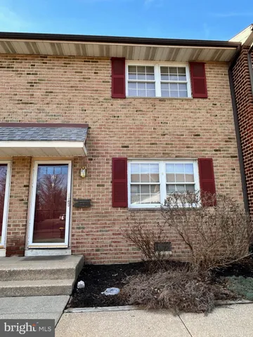 a front view of a house with stairs