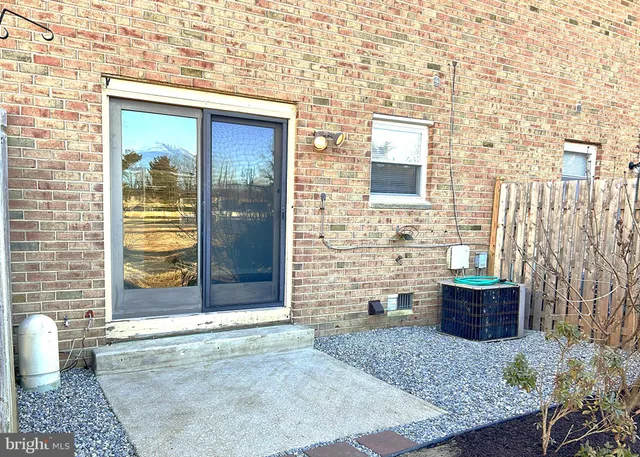 a view of a brick house with outdoor space