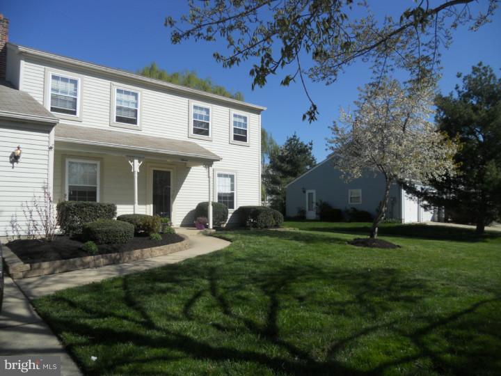 11 Nottingham Road Evesham, NJ 08053 - Photo 1 of 23 a front view of a house with garden and porch