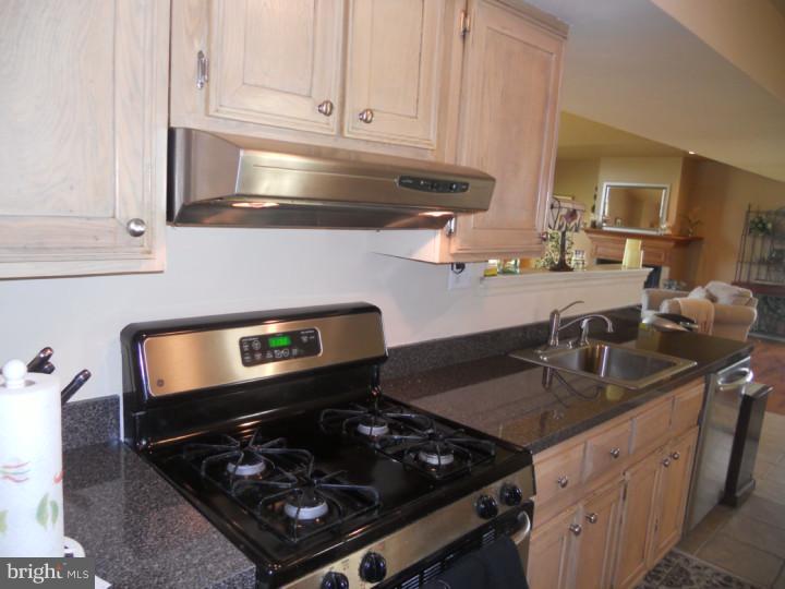 11 Nottingham Road Evesham, NJ 08053 - Photo 2 of 23 a kitchen with sink a stove and cabinets
