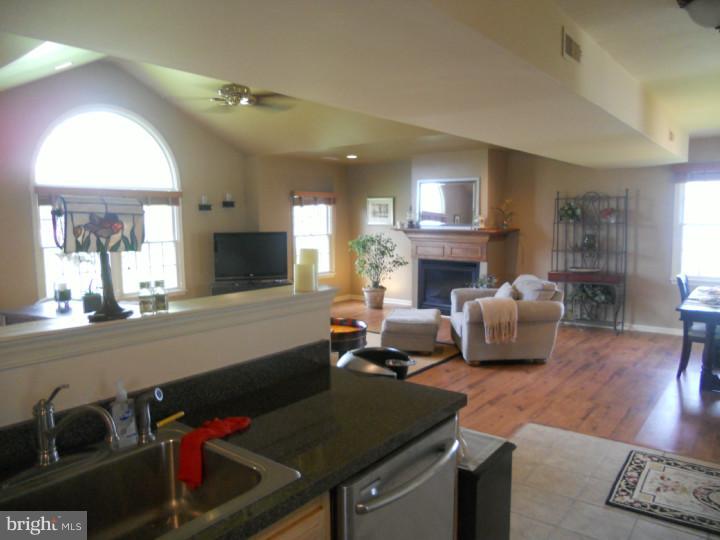 11 Nottingham Road Evesham, NJ 08053 - Photo 11 of 23 a living room with furniture a fireplace and a flat screen tv
