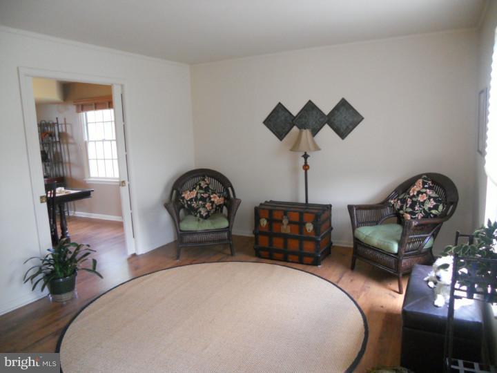 11 Nottingham Road Evesham, NJ 08053 - Photo 14 of 23 a bedroom with bed and a chandelier