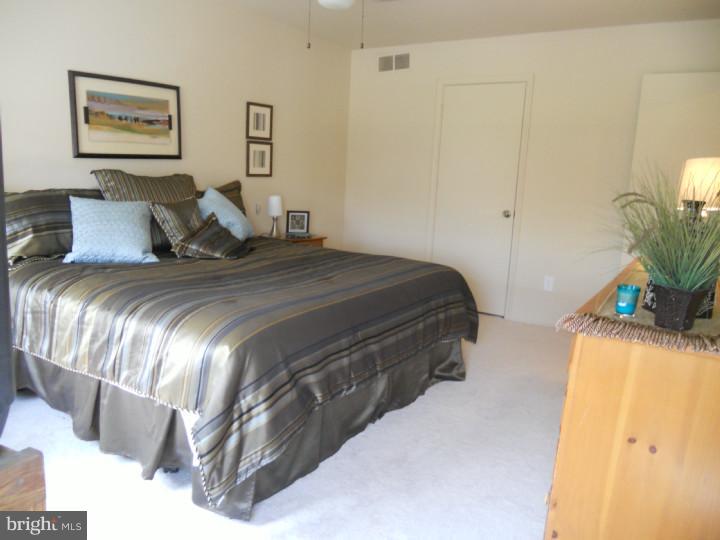 11 Nottingham Road Evesham, NJ 08053 - Photo 16 of 23 a bedroom with a bed and a potted plant