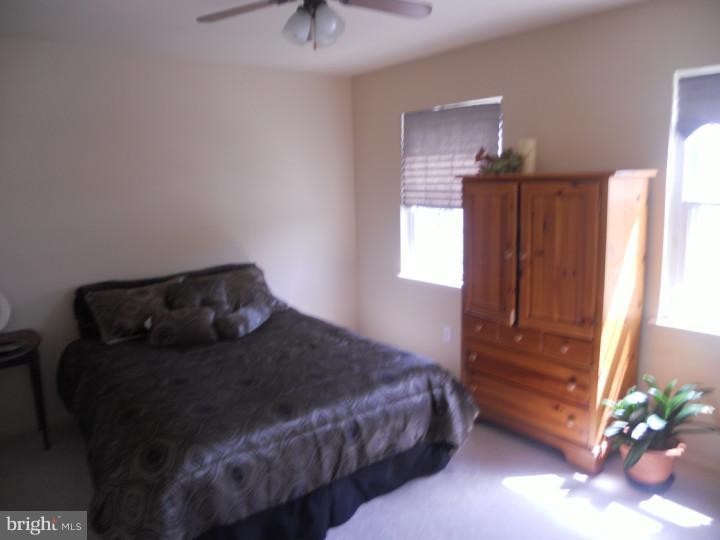 11 Nottingham Road Evesham, NJ 08053 - Photo 18 of 23 a bedroom with a bed and a potted plant
