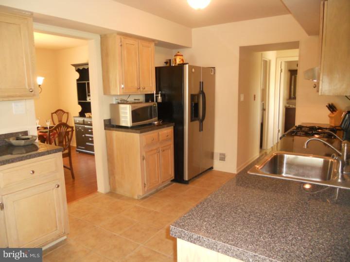 11 Nottingham Road Evesham, NJ 08053 - Photo 3 of 23 a kitchen with granite countertop a refrigerator and a sink
