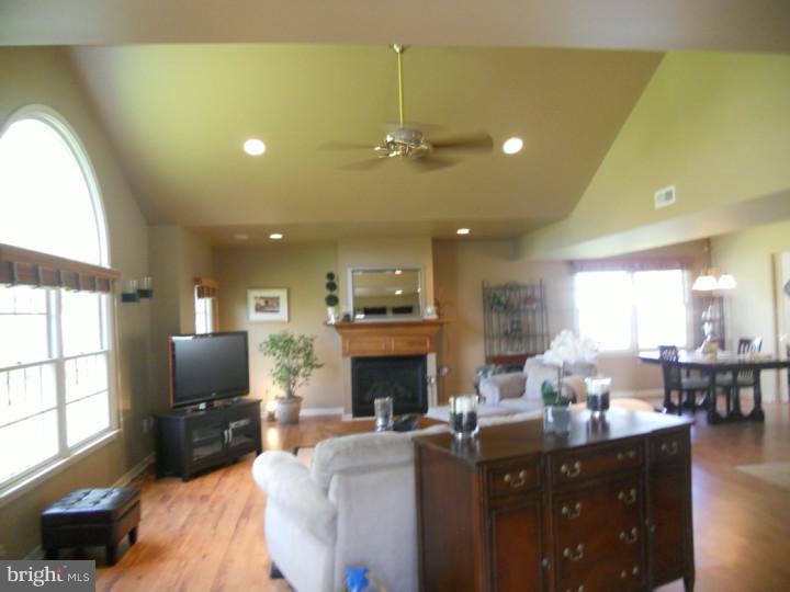 11 Nottingham Road Evesham, NJ 08053 - Photo 6 of 23 a living room with fireplace furniture and a flat screen tv