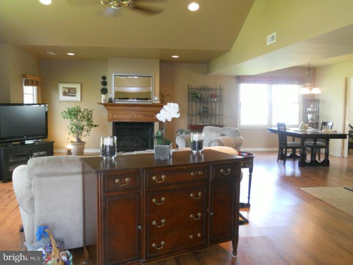 11 Nottingham Road Evesham, NJ 08053 - Photo 7 of 23 a living room with furniture a fireplace and a flat screen tv