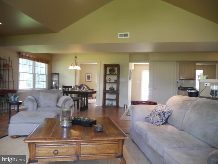 11 Nottingham Road Evesham, NJ 08053 - Photo 9 of 23 a living room with furniture and a chandelier
