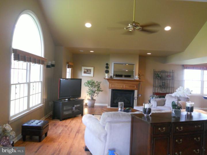 11 Nottingham Road Evesham, NJ 08053 - Photo 10 of 23 a living room with furniture fireplace and flat screen tv