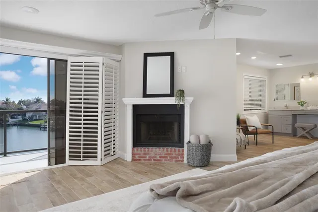 a bedroom with a bed and a ceiling fan