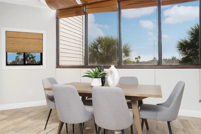 a view of a dining room with furniture and window