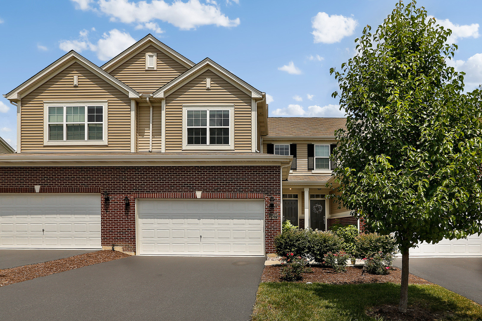 front view of a house with a yard