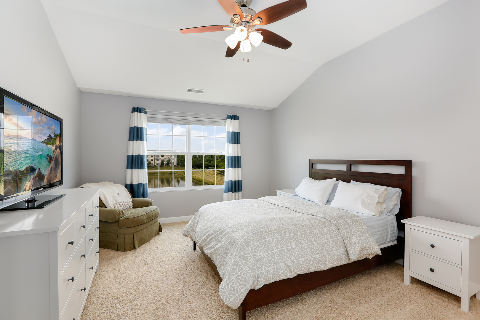 2827 Church Road Aurora, IL 60502 - Photo 17 of 30 a bedroom with a bed flat screen tv and a large window