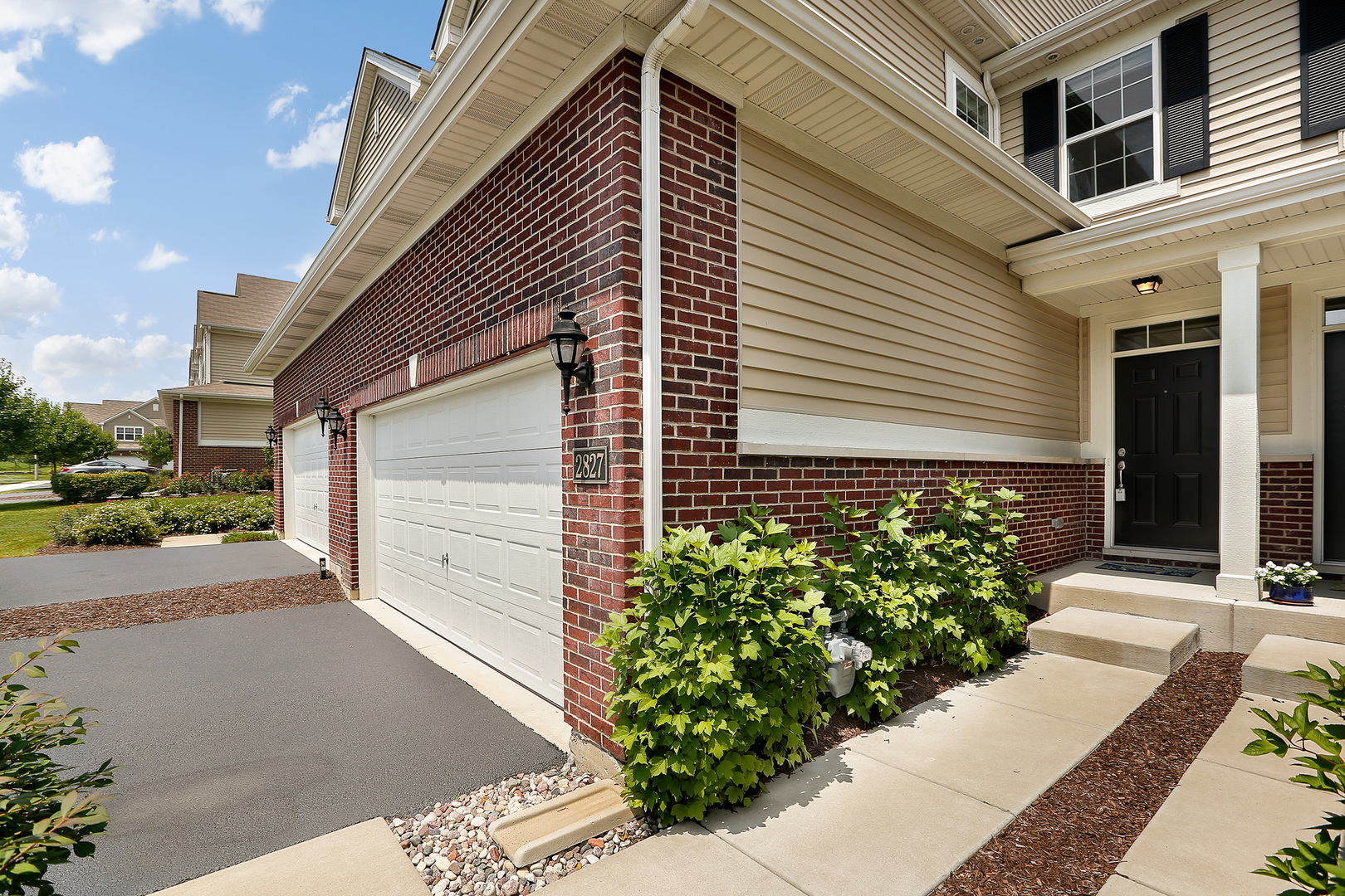 2827 Church Road Aurora, IL 60502 - Photo 3 of 30 a front view of a house with garden