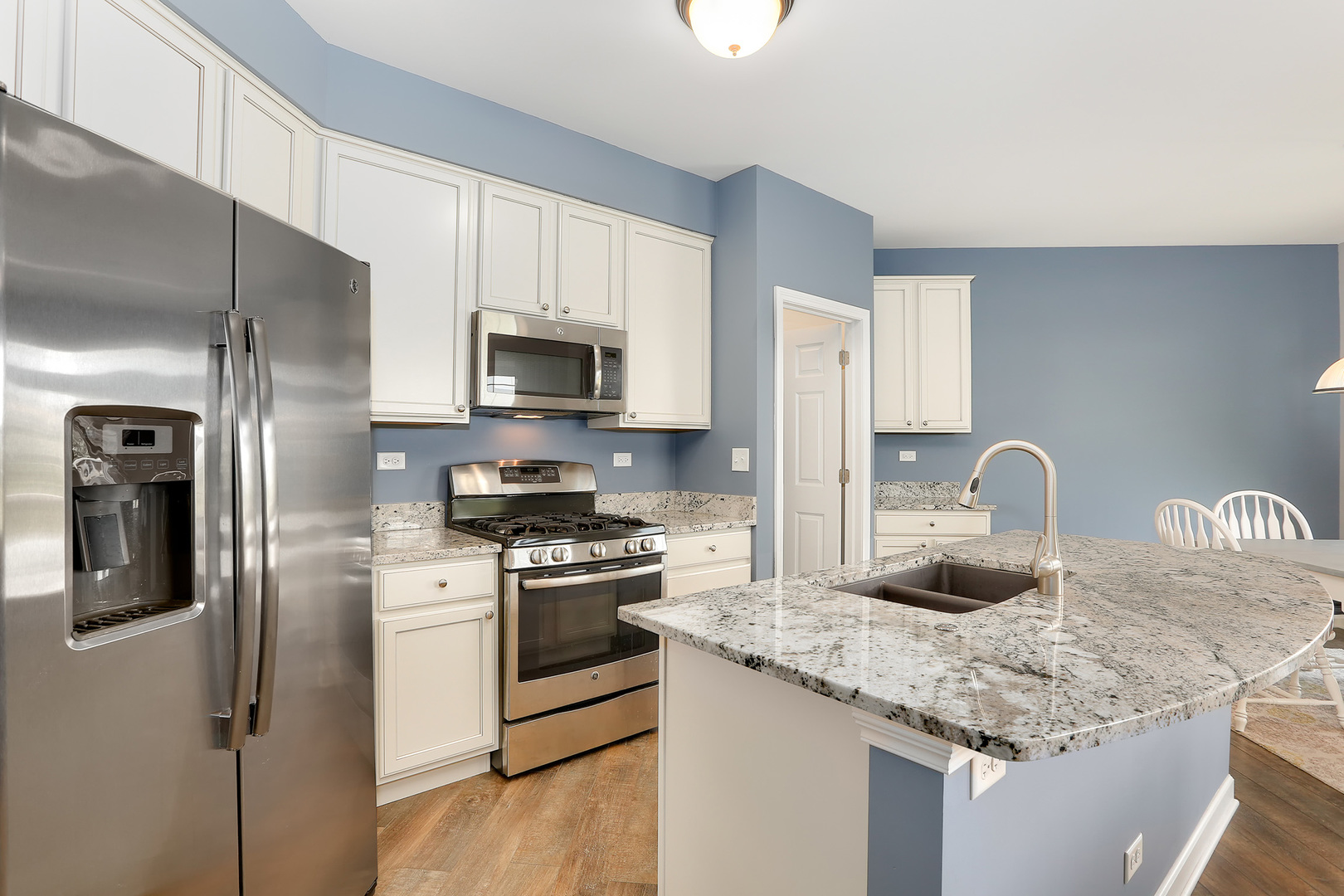 2827 Church Road Aurora, IL 60502 - Photo 9 of 30 a kitchen with stainless steel appliances granite countertop a refrigerator a stove top oven a sink and dishwasher