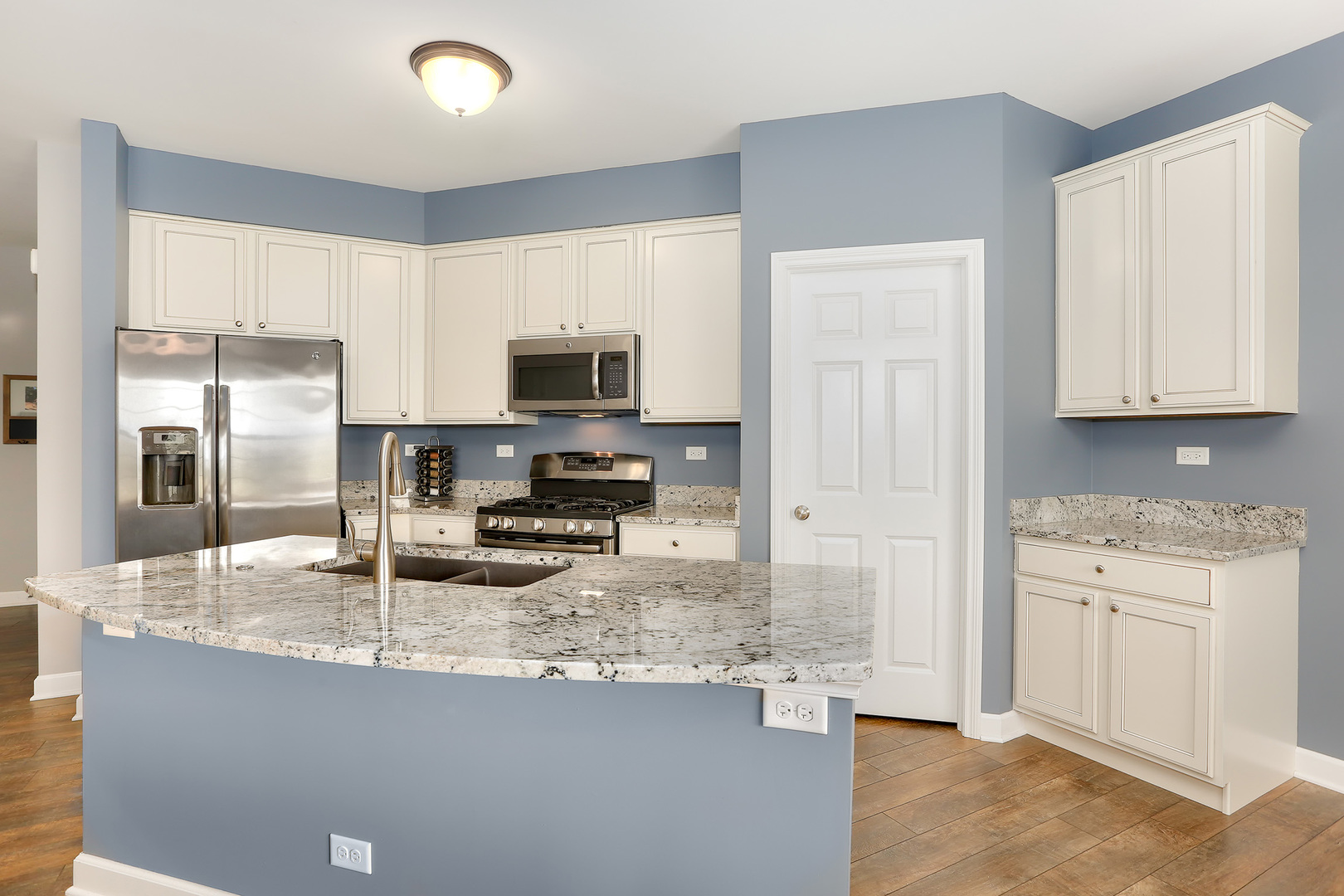 2827 Church Road Aurora, IL 60502 - Photo 10 of 30 a kitchen with stainless steel appliances granite countertop a stove a sink and a refrigerator