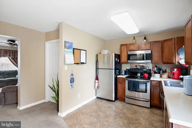 a view of a dining room with furniture and window