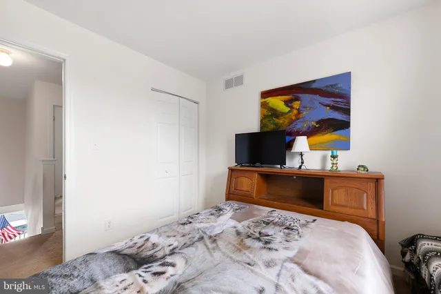 a bedroom with a bed and furniture