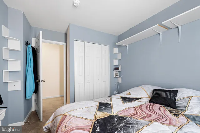 a bedroom with a bed and a table