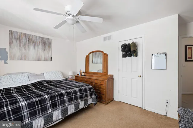 a living room with a flat screen tv and a window