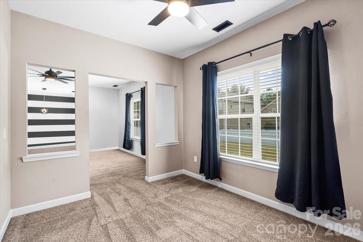 8836 Cornwall Street Locust, NC 28097 - Photo 13 of 42 a view of an empty room with a window