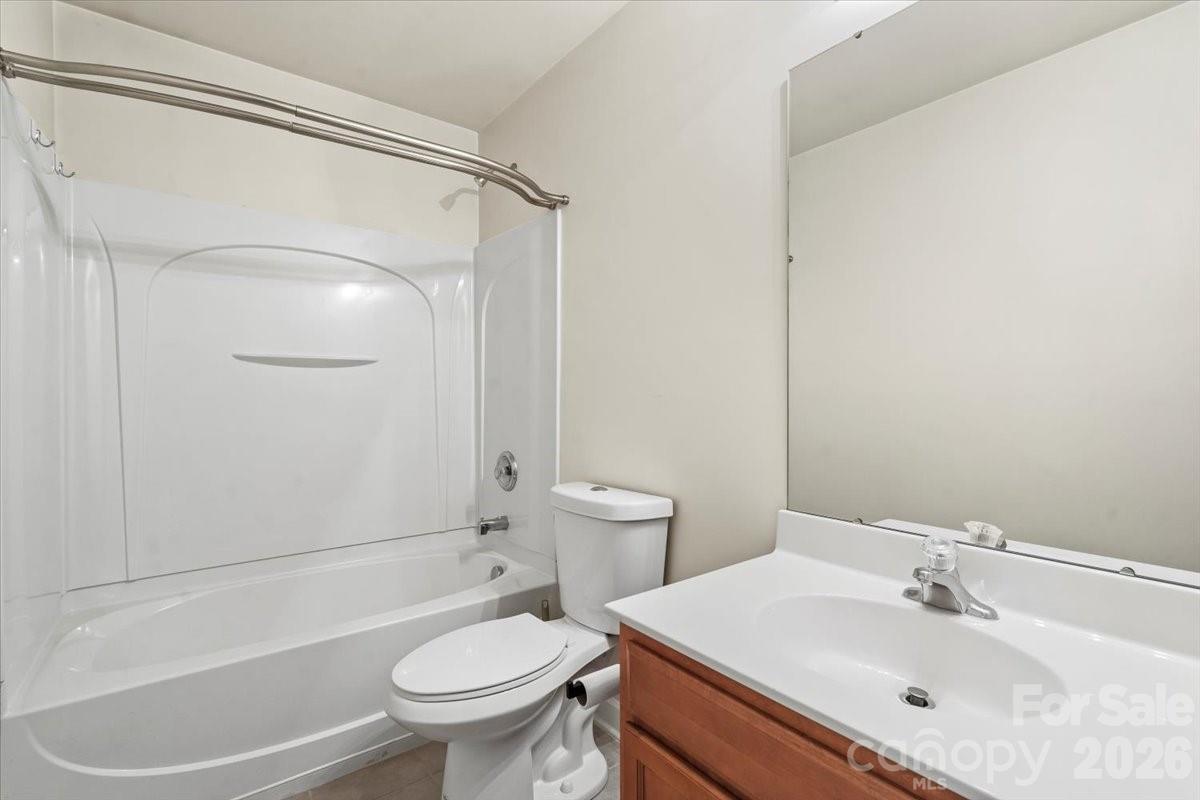 8836 Cornwall Street Locust, NC 28097 - Photo 27 of 42 a bathroom with a sink toilet and shower