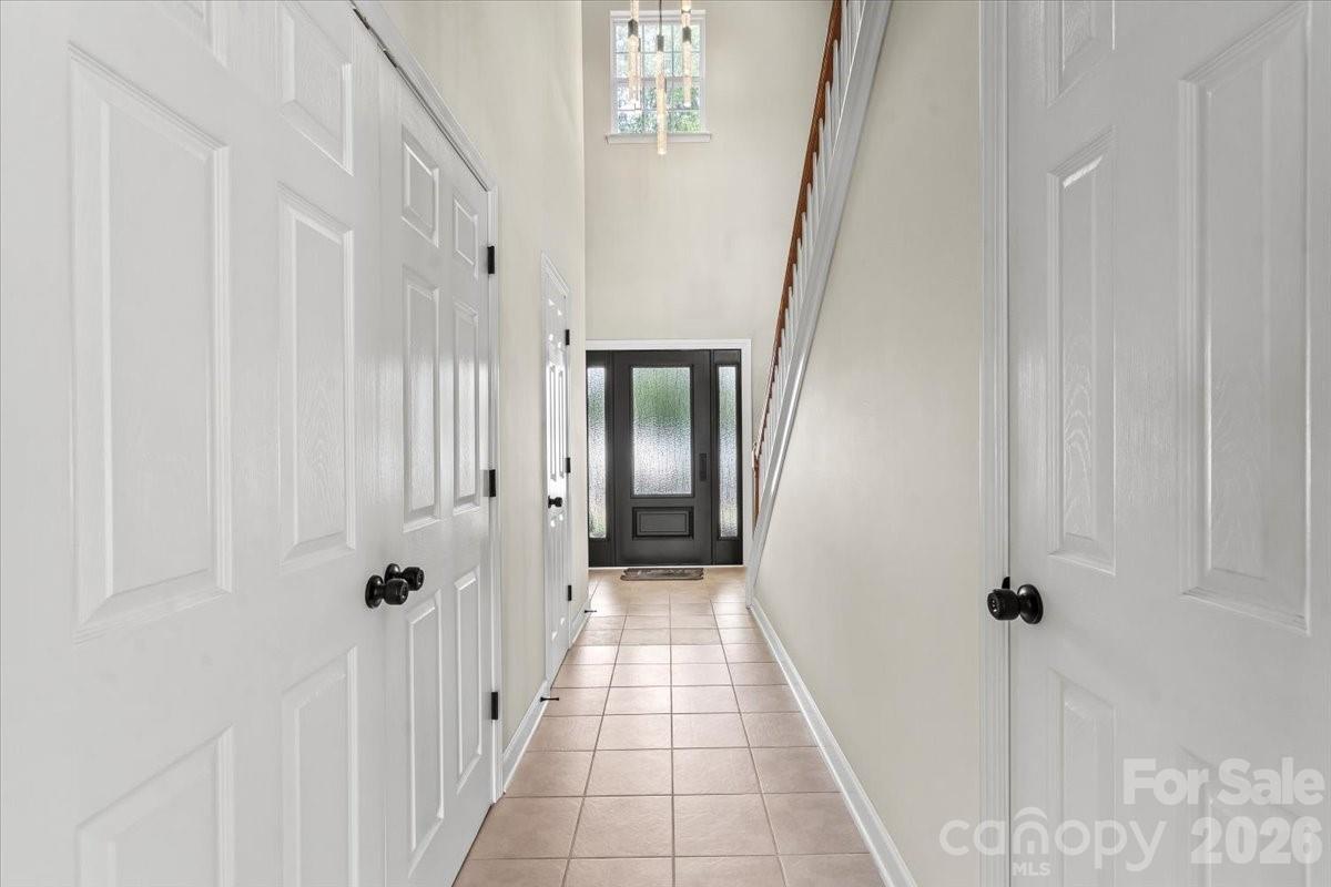 8836 Cornwall Street Locust, NC 28097 - Photo 3 of 42 a view of a hallway with a white walls