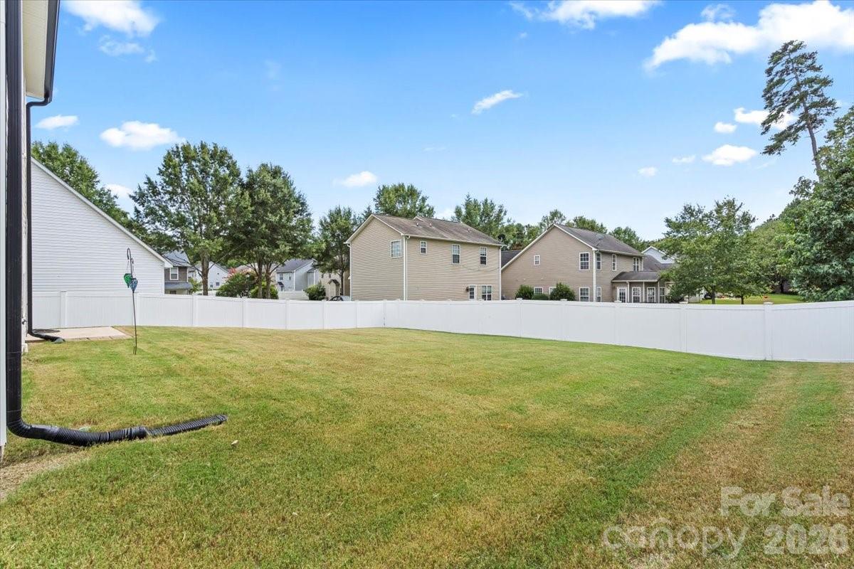 8836 Cornwall Street Locust, NC 28097 - Photo 32 of 42 a view of a house with a yard