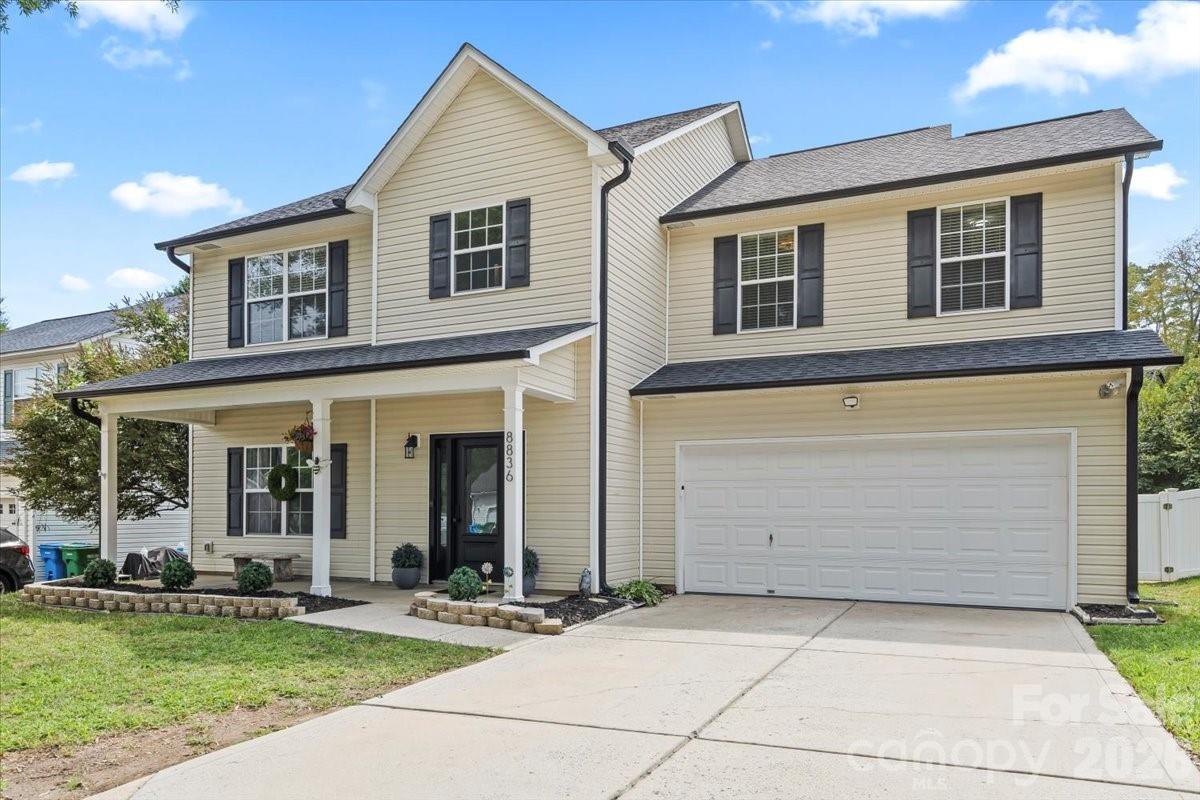 8836 Cornwall Street Locust, NC 28097 - Photo 34 of 42 a front view of a house with garden