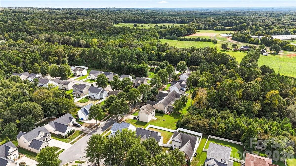 8836 Cornwall Street Locust, NC 28097 - Photo 36 of 42 an aerial view of residential houses with outdoor space