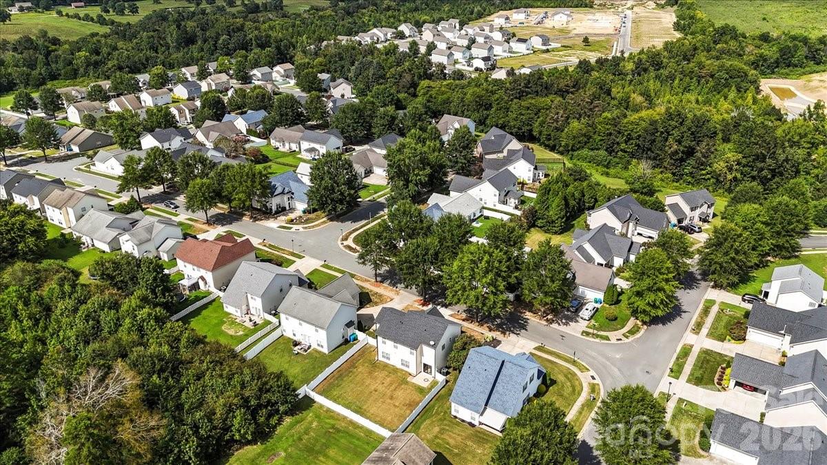 8836 Cornwall Street Locust, NC 28097 - Photo 41 of 42 an aerial view of residential houses with outdoor space