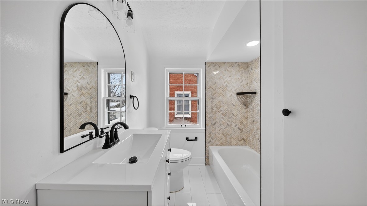 16811 Invermere Avenue Cleveland, OH 44128 - Photo 26 of 47 Full bath with vanity and light tile patterned floors