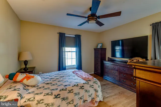a view of room with furniture and flat screen tv