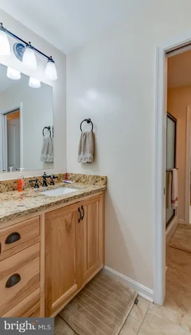 a bathroom with a toilet a sink and shower