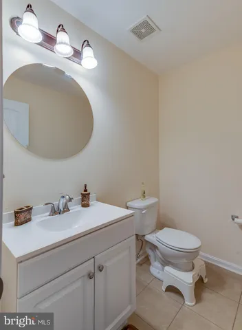 a kitchen with stainless steel appliances granite countertop a refrigerator and a stove