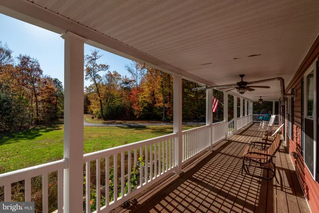 a front view of a house with a yard table and chairs