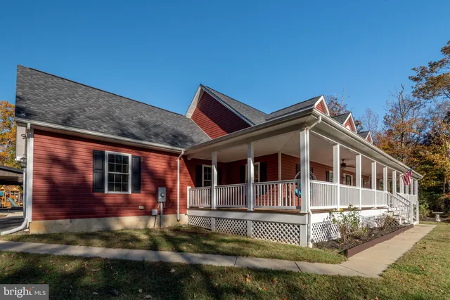 a view of a house with wooden deck
