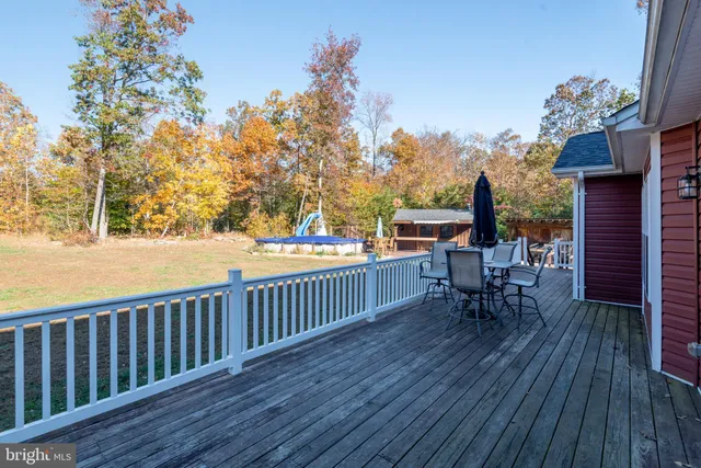 a view of balcony with wooden floor