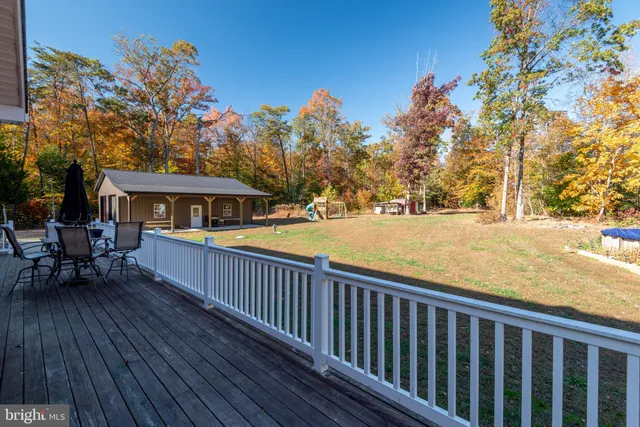 a view of a barn house next to a yard