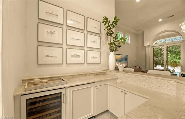 a view of a kitchen with a sink stove and cabinets