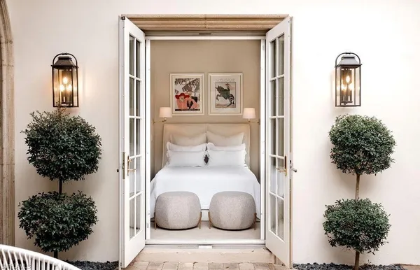 a living room with furniture and a potted plant