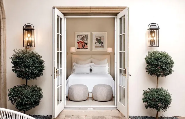 a living room with furniture and a potted plant