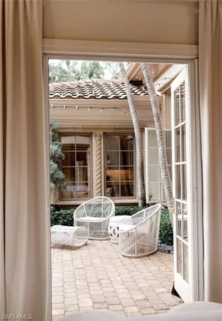 a view of a room that has a bed and a window