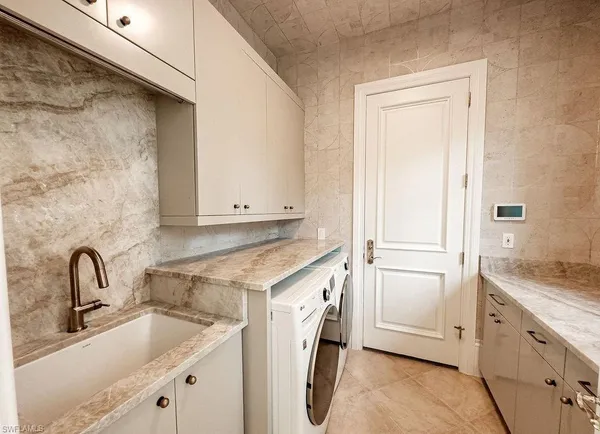 a view of a sink and dishwasher with a sink