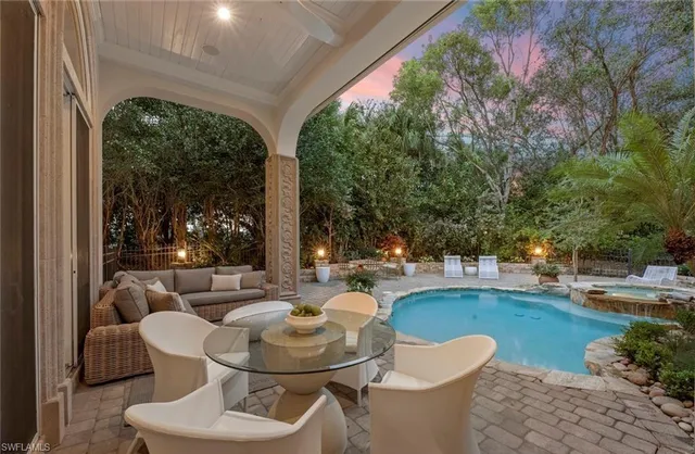 a view of a patio with couches chairs and a table