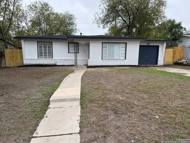 a house with trees in the background