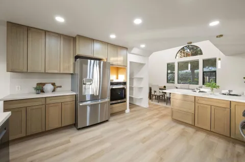 a dining room with furniture and wooden floor