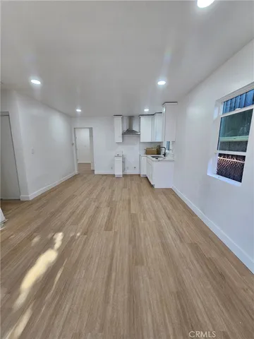 a view of a kitchen with a sink and cabinets