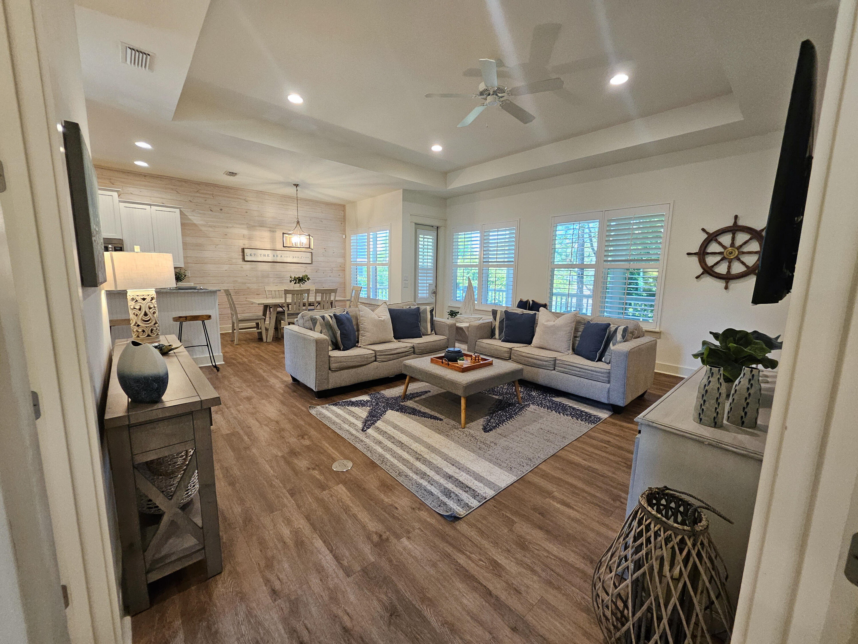 10 Gulfview Way Santa Rosa Beach, FL 32459 - Photo 14 of 40 a living room with furniture a rug kitchen view and a large window