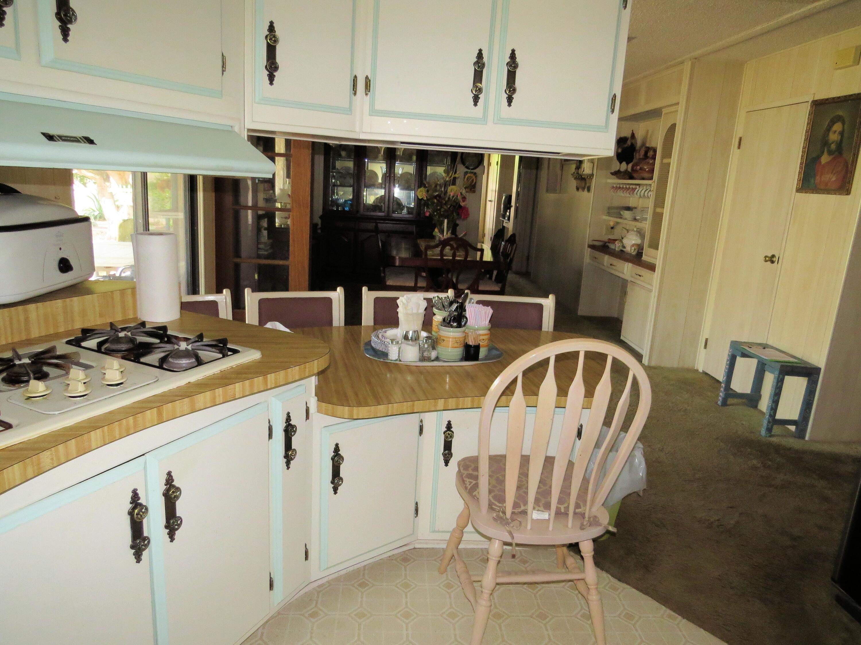 34980 Serenade Thousand Palms, CA 92276 - Photo 15 of 37 a view of a dining room with furniture
